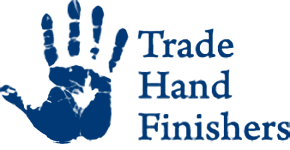 A blue hand print with the words trader hands finishing underneath.
